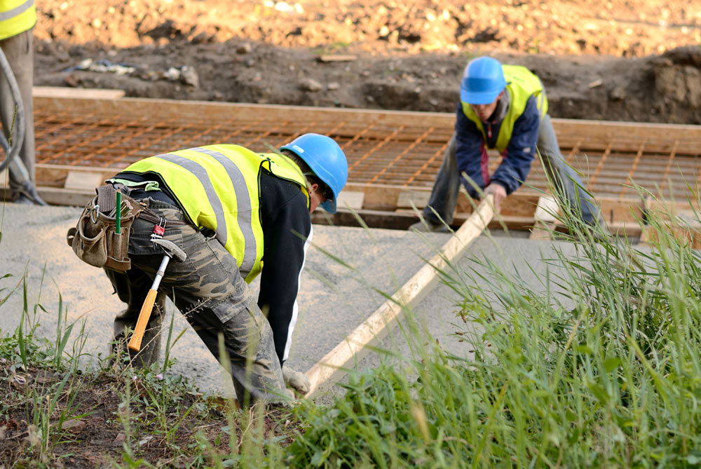 Two workers in road construction
